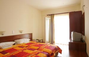 Postel nebo postele na pokoji v ubytování Hotel Metropole