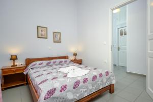 Posteľ alebo postele v izbe v ubytovaní NAXOS HOUSE