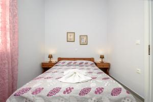 Posteľ alebo postele v izbe v ubytovaní NAXOS HOUSE