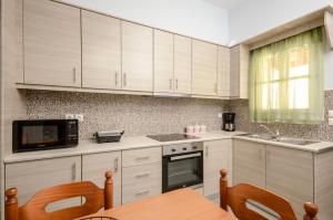 Kuchyňa alebo kuchynka v ubytovaní NAXOS HOUSE