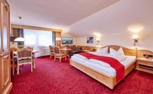 Postel nebo postele na pokoji v ubytování Hotel Franziska