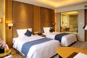Letto o letti in una camera di Wyndham Jingzhou