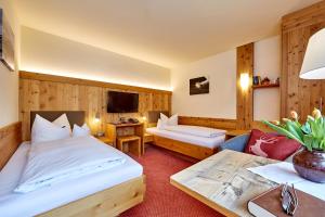 Postel nebo postele na pokoji v ubytování Hotel Franziska