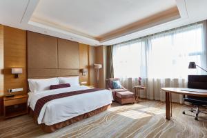 Letto o letti in una camera di Wyndham Jingzhou
