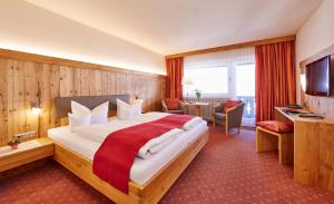 Postel nebo postele na pokoji v ubytování Hotel Franziska
