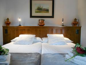 A bed or beds in a room at El Sequer Casa Rural