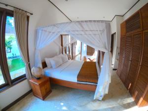 Postel nebo postele na pokoji v ubytování Agung Bali Nirwana Villas and Spa