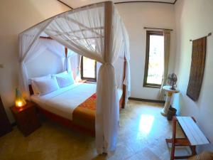 Postel nebo postele na pokoji v ubytování Agung Bali Nirwana Villas and Spa