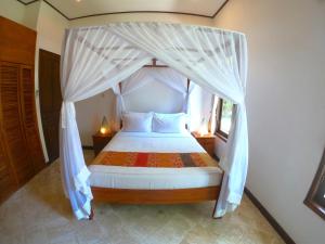 Postel nebo postele na pokoji v ubytování Agung Bali Nirwana Villas and Spa