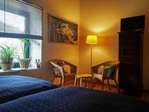 A bed or beds in a room at Hotel Rural Las Campares