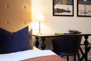 Voodi või voodid majutusasutuse Hotel Vejlefjord toas
