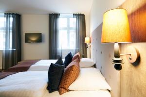 Voodi või voodid majutusasutuse Hotel Vejlefjord toas