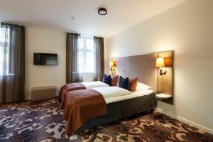 Voodi või voodid majutusasutuse Hotel Vejlefjord toas