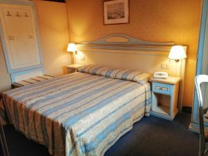 Postel nebo postele na pokoji v ubytování Hotel Falier