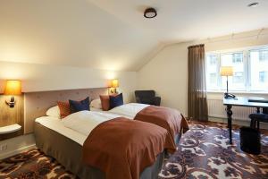 Voodi või voodid majutusasutuse Hotel Vejlefjord toas