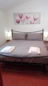 Postel nebo postele na pokoji v ubytování B&B Bucaneve
