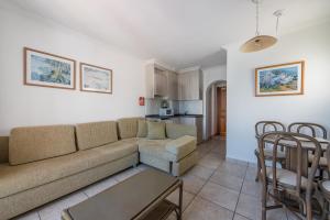 A seating area at Apartamentos Es Cañe