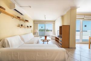 A bed or beds in a room at Apartamentos Es Cañe