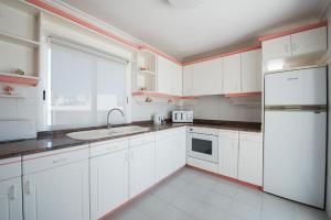 A kitchen or kitchenette at Apartamentos Es Cañe