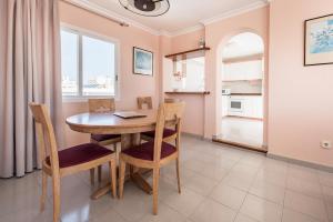 A kitchen or kitchenette at Apartamentos Es Cañe