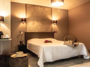 Postel nebo postele na pokoji v ubytování Sud Hôtel