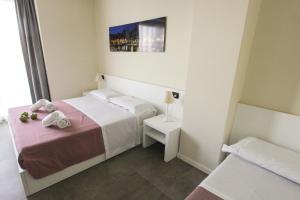 Postel nebo postele na pokoji v ubytování Garda Rooms