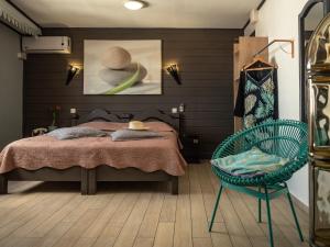 Postel nebo postele na pokoji v ubytování Sud Hôtel
