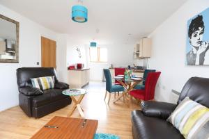 a living room with a couch and chairs and a table at The Avenue in Leamington Spa