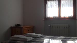 Postel nebo postele na pokoji v ubytování B&B Bucaneve