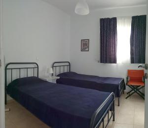 מיטה או מיטות בחדר ב-Garden house Karystos