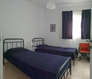 Posteľ alebo postele v izbe v ubytovaní Garden house Karystos