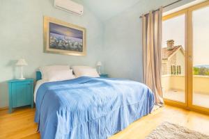 Postel nebo postele na pokoji v ubytování Luxury Villa Tia