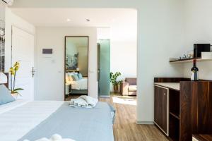 Postel nebo postele na pokoji v ubytování Atrium Ambiance Hotel
