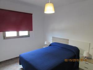 Postel nebo postele na pokoji v ubytování Seifía 2A