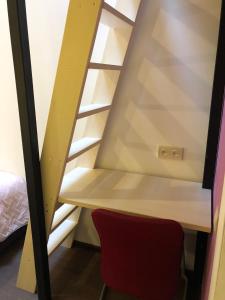 a room with a chair and a window at Dream Hostel Zaporizhia in Zaporozhye