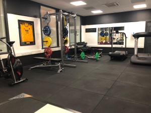 a gym with many equipment in a room at The Mount Country Manor Hotel & Golf Wolverhampton in Wolverhampton