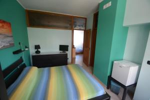 Postel nebo postele na pokoji v ubytování B&B LA BAIA Sea Rooms