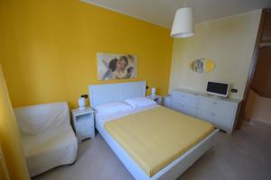 Postel nebo postele na pokoji v ubytování B&B LA BAIA Sea Rooms