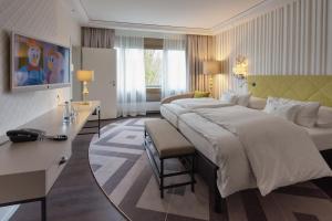 Ein Bett oder Betten in einem Zimmer der Unterkunft Insel-Hotel Heilbronn