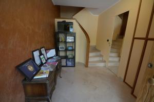 TV a/nebo společenská místnost v ubytování B&B LA BAIA Sea Rooms