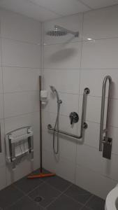 a bathroom with a shower stall with a toilet at Arava Hostel in Eilat