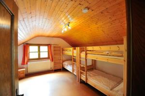 a room with two bunk beds and a window at Ferienhaus Hinterzarten in Hinterzarten