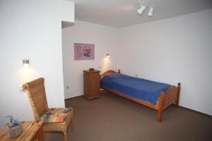 Ein Bett oder Betten in einem Zimmer der Unterkunft Wohnung Inge Ysker