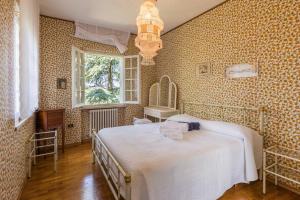Un pat sau paturi într-o cameră la Tenuta Rosara