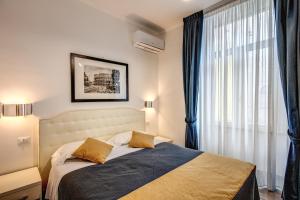 Postel nebo postele na pokoji v ubytování Four Rivers Suites