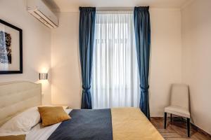 Postel nebo postele na pokoji v ubytování Four Rivers Suites