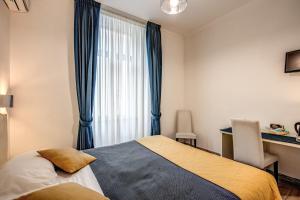 Postel nebo postele na pokoji v ubytování Four Rivers Suites