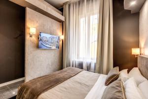 Postel nebo postele na pokoji v ubytování Four Rivers Suites