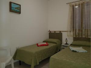 A bed or beds in a room at Salvia