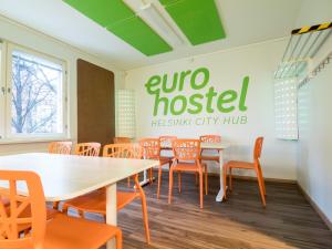 a dining room with a table and chairs at Eurohostel in Helsinki